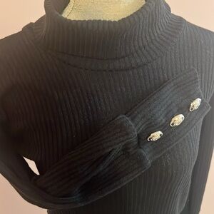 Women’s M black turtleneck with gold accent buttons on the wrist